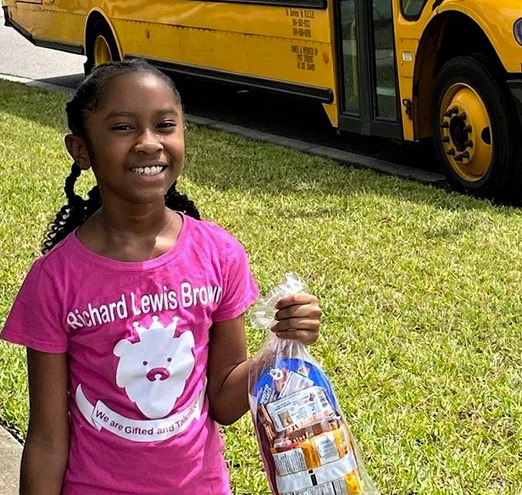 child holding prepacked food