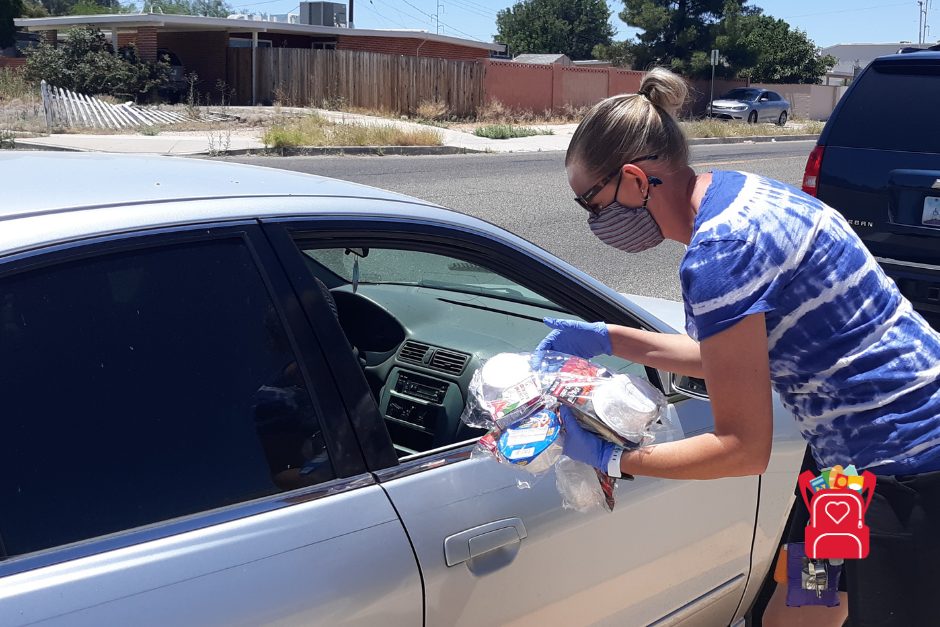 volunteer distributing food during COVID